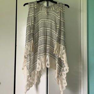 Crochet vest with scalloped edged lace